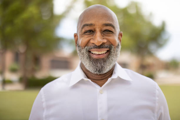 An African American male business man portrait outdoors.